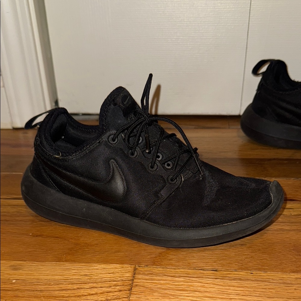 Nike Black Sneakers with Mesh Upper and Monochrome Design
